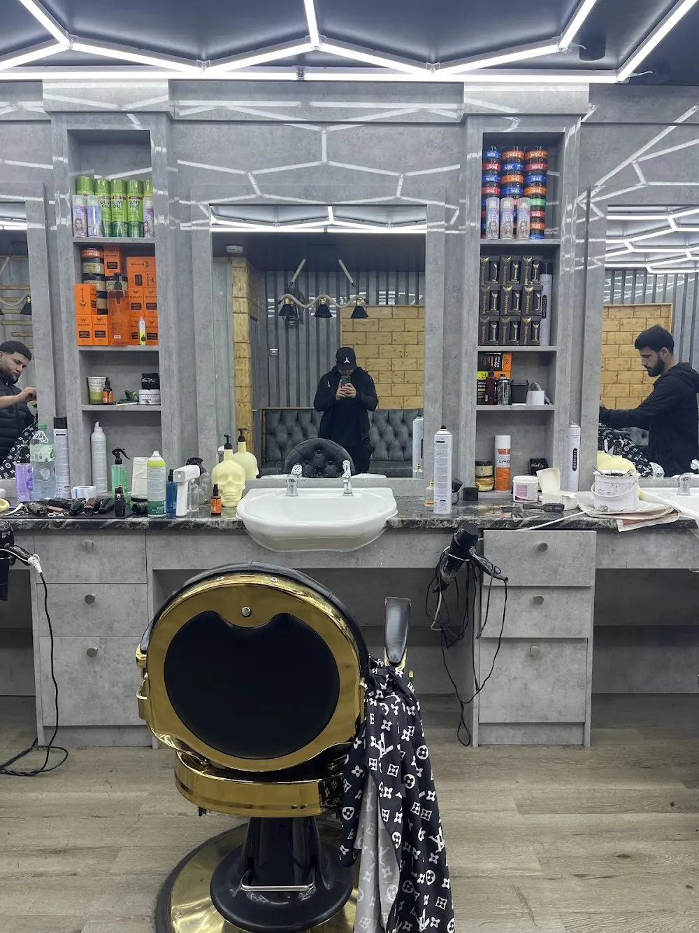 Gold and black barber chairs in a row